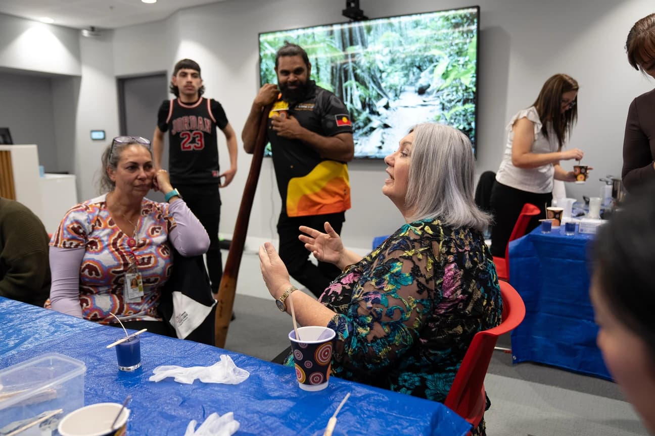 A community workshop in session around a table